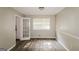 Bright dining room features elegant chair rail, modern vinyl floors, and a French door that leads to the kitchen at 115 Fairview Way, Stockbridge, GA 30281