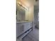 Modern bathroom featuring a double sink vanity with granite countertops and brushed nickel fixtures at 1525 Racquet Club Dr, Lawrenceville, GA 30043
