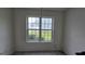 Bright bedroom with white trim window overlooking yard at 1525 Racquet Club Dr, Lawrenceville, GA 30043
