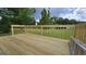 New wood deck overlooking a large, grassy yard with trees, offering a serene outdoor space at 1525 Racquet Club Dr, Lawrenceville, GA 30043