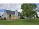 Charming home with a new deck and a spacious, well-maintained lawn and mature trees at 1525 Racquet Club Dr, Lawrenceville, GA 30043