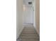 Bright hallway featuring modern wood-look floors leading to various rooms at 1525 Racquet Club Dr, Lawrenceville, GA 30043