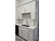 Kitchen with white cabinets, stainless steel sink and faucet, and white countertops at 1525 Racquet Club Dr, Lawrenceville, GA 30043