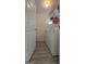 Laundry room featuring wood-look floors, shelving, and a modern washer and dryer at 1525 Racquet Club Dr, Lawrenceville, GA 30043