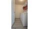 Practical laundry room equipped with a washer, dryer, and shelving for storage at 1525 Racquet Club Dr, Lawrenceville, GA 30043