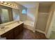 Primary bathroom with dual sinks, soaking tub, separate shower, and natural light at 4551 Mitchells Meadow Ln, Ellenwood, GA 30294