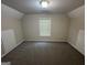 Bonus room with carpet and a single window at 4551 Mitchells Meadow Ln, Ellenwood, GA 30294