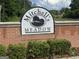 Mitchell's Meadow community sign at the entrance, showcasing landscaping at 4551 Mitchells Meadow Ln, Ellenwood, GA 30294