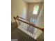 Entryway view from the stairs with carpet and a large window at 4551 Mitchells Meadow Ln, Ellenwood, GA 30294