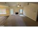 Bright living room with fireplace and access to outdoor area through door at 4551 Mitchells Meadow Ln, Ellenwood, GA 30294