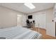 Finished bedroom with desk, tv, closet and comfortable bed at 2622 Murdock, Marietta, GA 30062