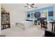 Comfortable bedroom with a modern design, featuring blue accents, a desk, and ample natural light at 2622 Murdock, Marietta, GA 30062