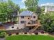Charming two-story home with a wooden deck and well-manicured lawn and landscape at 2622 Murdock, Marietta, GA 30062
