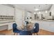 An eat-in kitchen with breakfast table, and updated white cabinets and stainless steel appliances at 2622 Murdock, Marietta, GA 30062