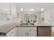 Close up shot of kitchen features granite countertops, stainless steel appliances, and a stainless steel sink at 2622 Murdock, Marietta, GA 30062