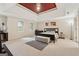 Spacious main bedroom with a tray ceiling, carpet, and a walk-in closet at 2622 Murdock, Marietta, GA 30062
