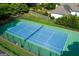Aerial view of tennis court with green and blue surface and a black fence at 2622 Murdock, Marietta, GA 30062