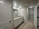 Beautiful bathroom with a double vanity, granite countertop, and a glass-enclosed shower at 11045 Shadow Creek Ter # 65, Hampton, GA 30228
