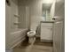 Well-maintained bathroom features a shower-tub combo, vinyl flooring, and vanity at 11045 Shadow Creek Ter # 65, Hampton, GA 30228