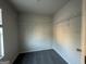 Walk-in closet, freshly painted, with carpet and wire rack shelves for ample storage at 11045 Shadow Creek Ter # 65, Hampton, GA 30228