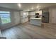 Bright kitchen with stainless steel appliances, island, and granite countertops at 11045 Shadow Creek Ter # 65, Hampton, GA 30228