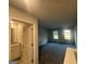 Spacious loft area with two windows and bathroom with vanity at 11045 Shadow Creek Ter # 65, Hampton, GA 30228