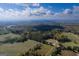 Beautiful overhead view of rolling hills, vast forest, and sprawling fields at 335 Gum Creek Rd, Roopville, GA 30170