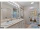 Bathroom featuring dual sinks, tile floors, and ample counter space at 335 Gum Creek Rd, Roopville, GA 30170