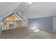 Bright bonus room with fresh carpet and natural light from large windows at 335 Gum Creek Rd, Roopville, GA 30170