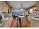 Open-concept kitchen with hardwood floors, large island, and stainless steel appliances at 335 Gum Creek Rd, Roopville, GA 30170