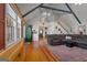 Comfortable living room with vaulted ceiling, wood accents, and staircase to upper level at 335 Gum Creek Rd, Roopville, GA 30170