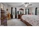 Spacious bedroom featuring ample natural light and dark wood furnishings at 335 Gum Creek Rd, Roopville, GA 30170