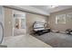 Room with tanning bed, white cabinets, tile flooring, and plush carpet for comfort at 335 Gum Creek Rd, Roopville, GA 30170