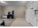 Recreation room with combination of tile and carpet, featuring bright white cabinetry and ample space at 335 Gum Creek Rd, Roopville, GA 30170