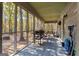 Spacious screened porch perfect for outdoor dining and grilling with wooded views at 335 Gum Creek Rd, Roopville, GA 30170