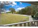 Scenic front yard and driveway of a lovely home, viewed from a porch at 335 Gum Creek Rd, Roopville, GA 30170