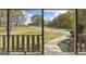 Scenic front yard and driveway of a lovely home, viewed from a porch at 335 Gum Creek Rd, Roopville, GA 30170
