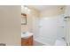 Bathroom featuring single vanity and shower/tub combo with updated fixtures at 5523 Forest Dr, Loganville, GA 30052