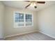 Cozy bedroom with neutral walls, carpet floors, ceiling fan and a double window at 5523 Forest Dr, Loganville, GA 30052