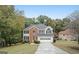 Charming two-story home featuring a brick facade and attached two-car garage at 5523 Forest Dr, Loganville, GA 30052