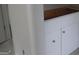 White bathroom cabinet with drawers, a modern design, and sleek silver hardware at 49 Durham Estates Dr, Sharpsburg, GA 30277