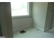 Bathroom with plumbing and drywall; window above possible tub location at 49 Durham Estates Dr, Sharpsburg, GA 30277