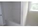 Clean, new bathtub with tiled walls and a window at 49 Durham Estates Dr, Sharpsburg, GA 30277