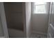 Bright bathroom with a window and a white shower and bathtub at 49 Durham Estates Dr, Sharpsburg, GA 30277