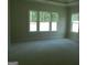 Bedroom with abundant natural light, thanks to its multiple windows providing a bright and inviting atmosphere at 49 Durham Estates Dr, Sharpsburg, GA 30277
