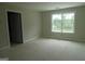 Bedroom with a window providing natural light at 49 Durham Estates Dr, Sharpsburg, GA 30277