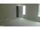 Spacious bedroom featuring a window for natural light and double-door closet at 49 Durham Estates Dr, Sharpsburg, GA 30277