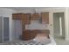 Kitchen under construction features wood cabinets, offering a glimpse of potential and modern design at 49 Durham Estates Dr, Sharpsburg, GA 30277