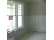 Bright, spacious living area features large windows and pristine white trim accents at 49 Durham Estates Dr, Sharpsburg, GA 30277