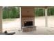 An outdoor patio with a stone fireplace is seen at 49 Durham Estates Dr, Sharpsburg, GA 30277